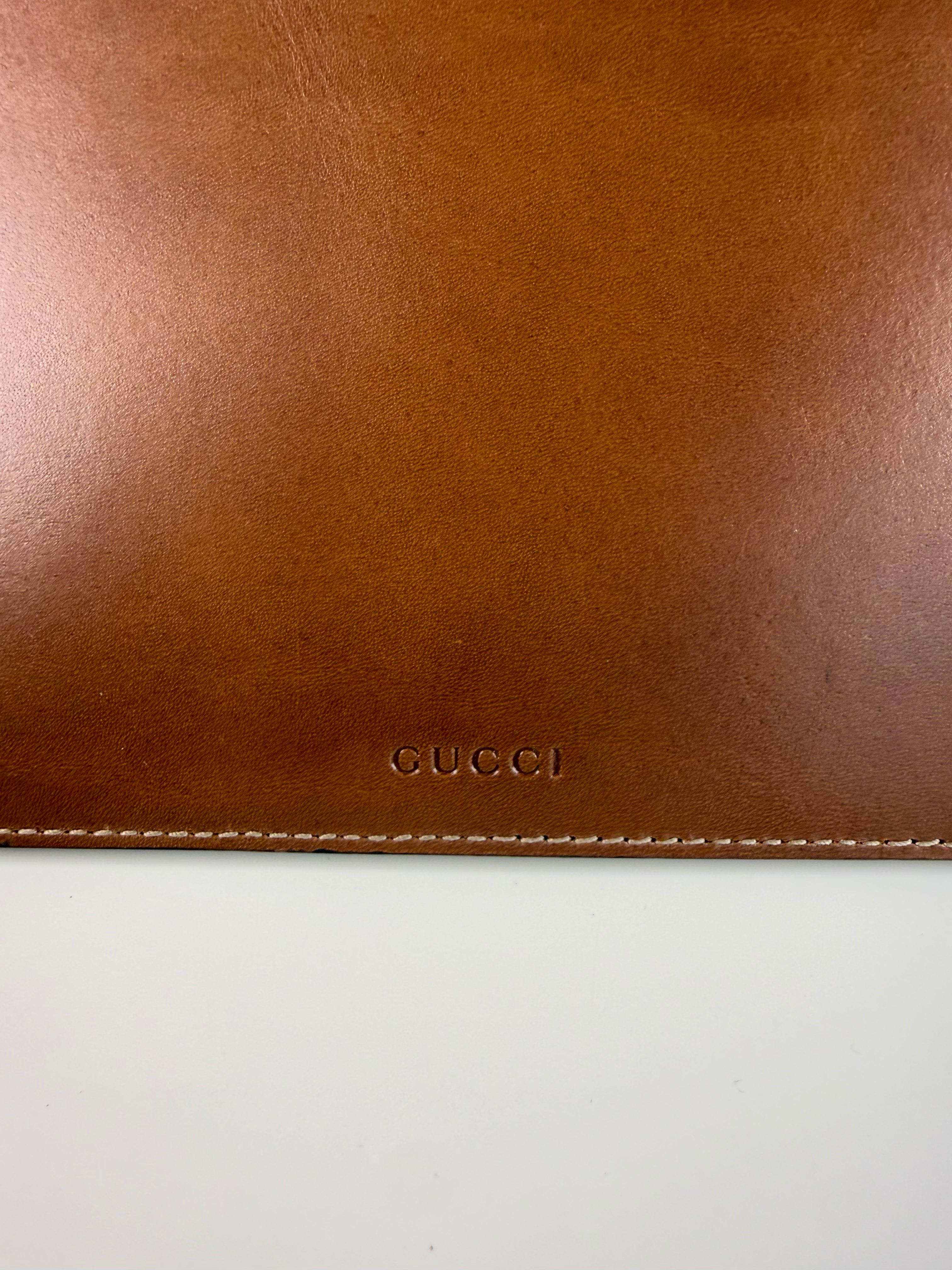 Pochette fleuri monogramme Gucci