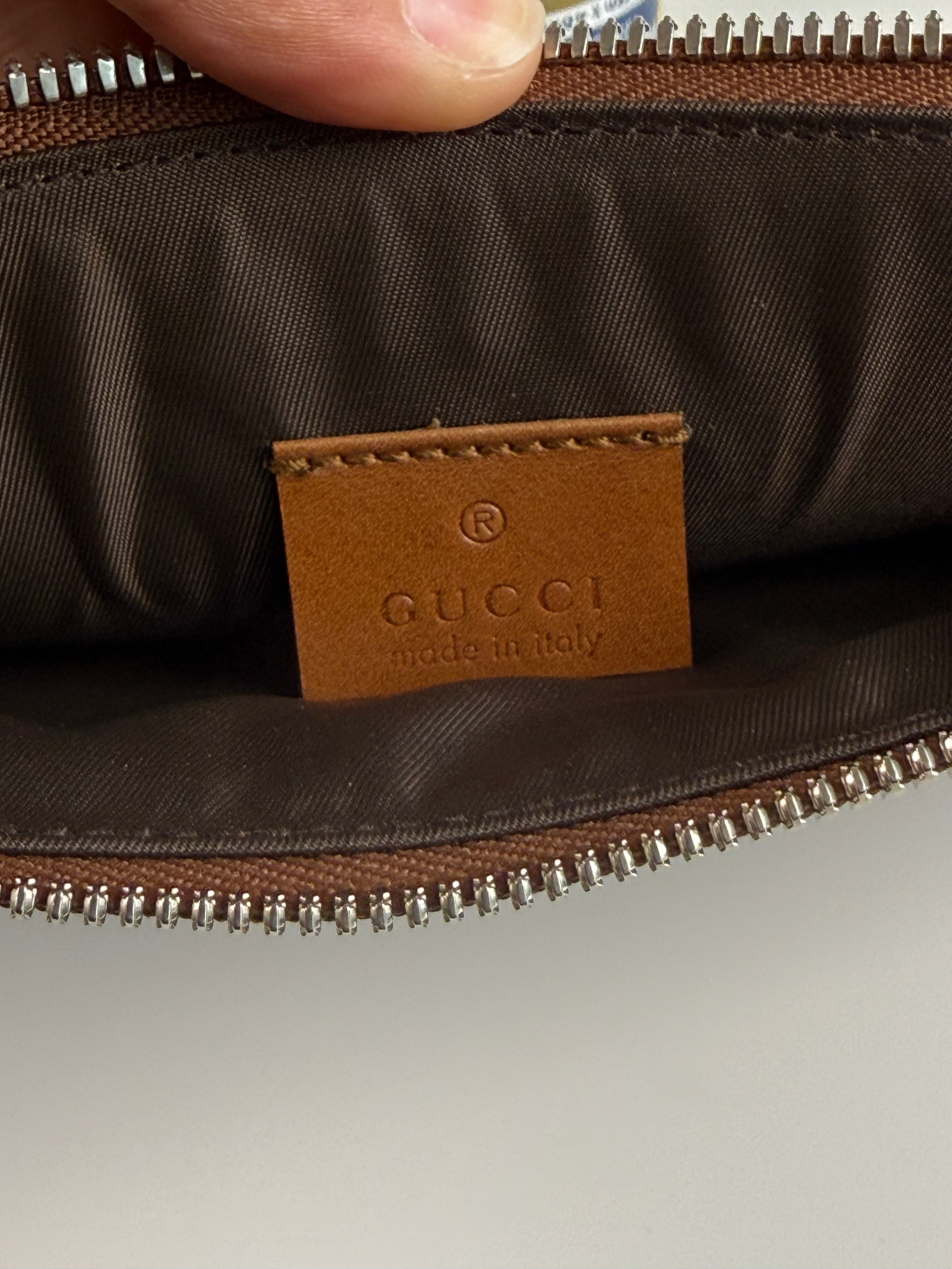 Pochette fleuri monogramme Gucci