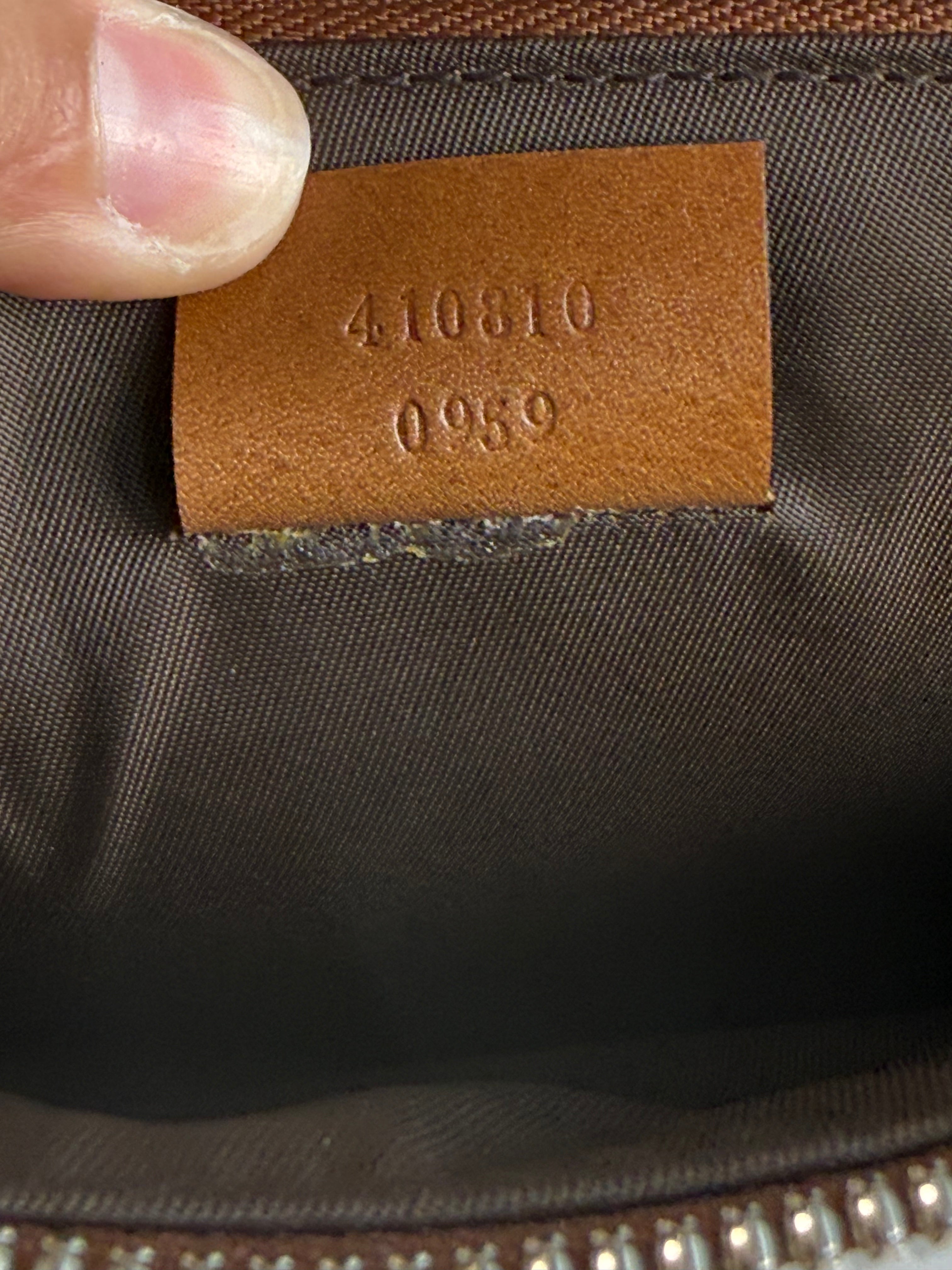 Pochette fleuri monogramme Gucci